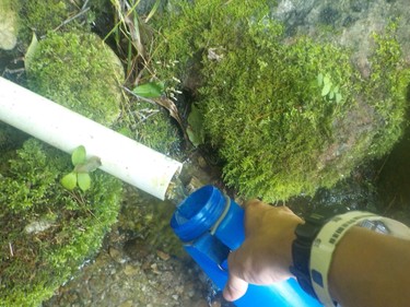 On Day 100 it's time to refill the water bottle straight from a pipe on the AT in Connecticut. Many hikers carry lifestraws to filter natural water sources along the trail. 
IAN NEWTON/Special to Postmedia News
Appalachian Trail 2019