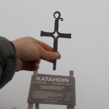 Appalachian Trail thru-hiker Ian Newton raises over the "finish line" the iron cross he carried on his five-month trek from Georgia to the summit of Maine's 5,267-foot Mount Katahdin.
IAN NEWTON/Special to Postmedia News
Appalachian Trail 2019