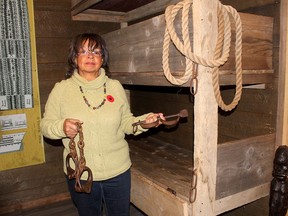 Shannon Prince, curator of the Buxton National Historic Site and Museum, holds two different types of shackles on display in the museum's depiction of the sleeping area of a slave ship. Prince was part of the public pressure that convinced Cineplex Entertainment to add Chatham to the locations for limited screenings of its new film, Harriet, about the Underground Railway.  Ellwood Shreve/Postmedia Network