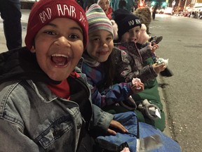 Do kids still love the Santa Claus Parade? Ask the trio (l-r) of Alex Austin-Greham, Oceanah Burdon and Raymond Hitchings as they watch the Santa Claus parade in London, Ont. on Saturday November 12, 2016. Craig Glover/The London Free Press