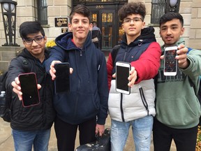 London Central secondary school students say there are pros and cons to a cell phone ban in class that began Monday. From left Mustafa Amin, Zaid Habayeb, Mohamad Salamah and Zaid Hassan. (Heather Rivers/London Free Press)