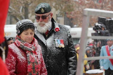 Silver Cross Mother Carolyn Wilson, whose son Mark was killed in Afghanistan, and Derrick McClinchey, the national president of the Canadian Army Veteran Motorcycle Unit, laid the first wreath at the cenotaph in Victoria Park during the Remembrance Day ceremony on Monday, Nov. 11, 2019. (DALE CARRUTHERS, The London Free Press)