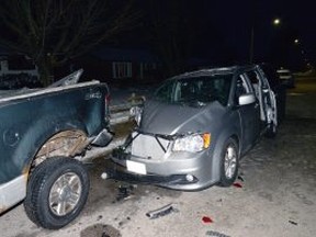 A St. Thomas woman was charged with impaired driving after a car collided with a parked pickup truck on Forest Avenue in St. Thomas at about 2 a.m. Friday. (Supplied)