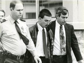 Jason Shawn Cofell, in handcuffs outside the Chatham courtroom, charged with first-degree murder of his grandparents Alfred & Virginia Critchley and Jasen Pangubrn 1992. (London Free Press files)