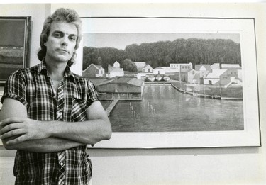 Artist Klaas Verboom stands beside his mixed media patining, Port Stanley - Pier 2, 1987. (London Free Press files)