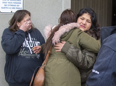 Brittany Chrisjohn is hugged by a supporter outside of the courthouse in London, Ont. on Friday November 1, 2019. London police Const. Nicholas Doering was found guilty of criminal negligence causing death and failing to provide the necessaries of life in the 2016 death of Brittany's sister Debra Chrisjohn. (Derek Ruttan/The London Free Press)