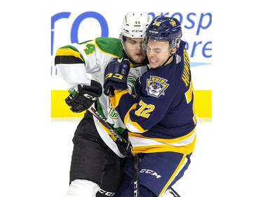 London Knight Jonathan Gruden connects with Drew Hunter of the Erie Otters during the first period of their OHL hockey game in London, Ont. on Saturday November 2, 2019. Derek Ruttan/The London Free Press/Postmedia Network