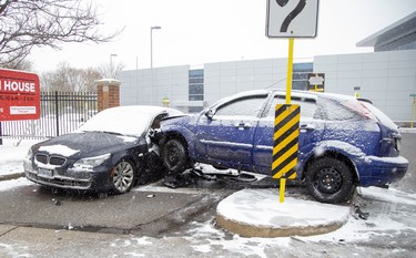 Even though it was not on a road, a -two-vehicle collision at an Oxford Street entrance to Fanshawe College snarled traffic in London, Ont. on Monday November 11, 2019 as tow trucks blocked the right lane and drivers slowed to look at the wreckage.  Derek Ruttan/The London Free Press/Postmedia Network