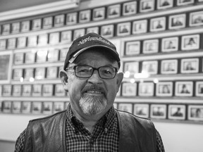 Ark Aid Street Mission assistant director Wayde Fosse in front a wall of photographs of regular clients and friends of the mission in London on Monday November 11, 2019. Derek Ruttan/The London Free Press