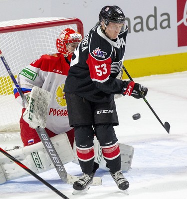 Ty Dellandrea of Team OHL  screens Team Russia goalie Amir Miftakhov during the first period of their game in London, Ont. on Monday November 11, 2019. The goalie didn't see the shot but it rang off the crossbar.Derek Ruttan/The London Free Press/Postmedia Network