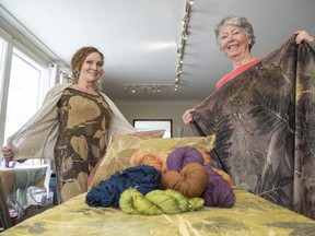 Kate Gutteridge (left) and Beth Whitney are textile artists in London. They are seen here with wool and fabric that Kate dyed. (Derek Ruttan/The London Free Press)