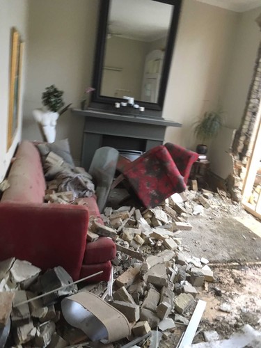 Diane Yeo's living room at 45 Blackfriars Street after a car crashed into it on October 27 in London, Ont. on Sunday October 27, 2019. Derek Ruttan/The London Free Press/Postmedia Network