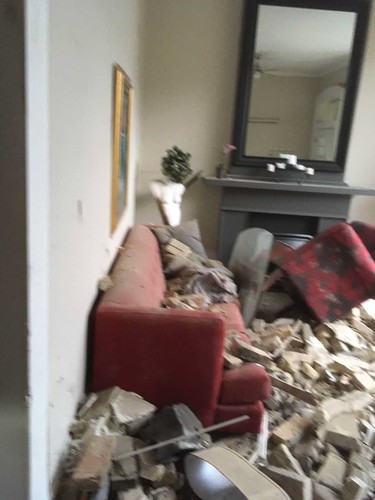 Diane Yeo's living room at 45 Blackfriars Street after a car crashed into it on October 27 in London, Ont. on Sunday October 27, 2019. Derek Ruttan/The London Free Press/Postmedia Network