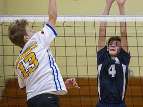 Oakridge's Brennan Veenstra hits the ball past CCH's Tyler Hrywkiw in their WOSSAA AAA junior championship match at Oakridge secondary school in London on Wednesday. The senior Oaks defeated the Stratford Huskies 25-13, 25-20, 25-20 in their championship match. DEREK RUTTAN/The London Free Press