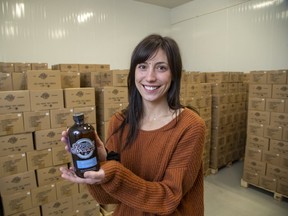 Shannon Kamins, owner of Booch Organic Kombucha, has thousands of bottles of the fermented tea in a refrigerator at the brewery. The business has partnered with Lawson Health Research Institute to investigate fermented foods, including an up-and-coming study to feed Booch to seniors at Parkwood Hospital. in London. (Derek Ruttan/The London Free Press)