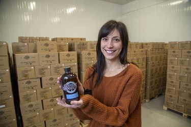 Shannon Kamins, owner of Booch Organic Kombucha, has thousands of bottles of the fermented tea in a refrigerator at the brewery. The business has partnered with Lawson Health Research Institute to investigate fermented foods, including an up-and-coming study to feed Booch to seniors at Parkwood Hospital. in London. (Derek Ruttan/The London Free Press)