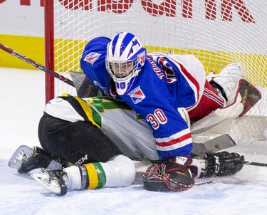 London Knight Luke Evangelista crashes into Kitchener Rangers goalie Nathan Torchia during the first period of their game  in London, Ont. on Sunday November 17, 2019. (Derek Ruttan/The London Free Press)