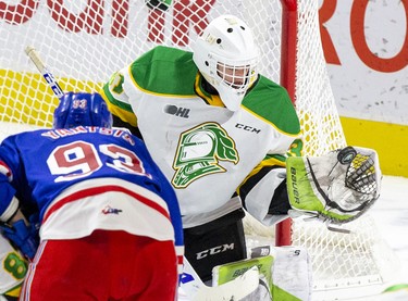 London Knights goalie Dylan Myskiw makes a glove save in front of Kitchener Rangers forward Jonathan Yantsis during the third period of their game  in London, Ont. on Sunday November 17, 2019. Derek Ruttan/The London Free Press/Postmedia Network