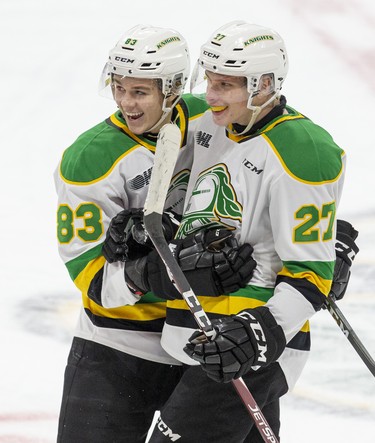 Hunter Skinner (83) congratulates London Knights teammate Kirill Steklov after scoring his first OHL goal during the third period of their game agains the Kitchener Ranges in London, Ont. on Sunday November 17, 2019. Derek Ruttan/The London Free Press/Postmedia Network