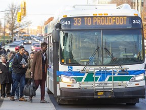 Citizens board an LTC bus on Western Road at Sarnia Road in London, Ont. on Wednesday Nov. 20, 2019. Left out of the city's bus rapid transit plans, three city councillors are exploring a "higher-order" transit option for the city's west end. (Derek Ruttan/The London Free Press)