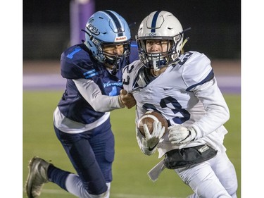 Lucas Viking Moaaz Moustafa grabs CCH ball carrier Luke Ciapka  during the WOSSAA senior football championship game at TD Stadium in London, Ont. on Thursday Nov. 21, 2019. (Derek Ruttan/The London Free Press)