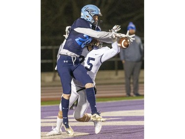CCH defender Keegan Vanek prevents a touchdown catch by Sam Spoelstra of the Lucas Vikings  during the WOSSAA senior football championship game at TD Stadium in London, Ont. on Thursday Nov. 21, 2019. (Derek Ruttan/The London Free Press)