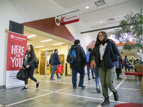 People walk the halls of Fanshawe College in London on Friday. An Ontario court has overturned government rules that allowed students to opt out of many fees to support non-academic programming at colleges and universities. (Derek Ruttan/The London Free Press)