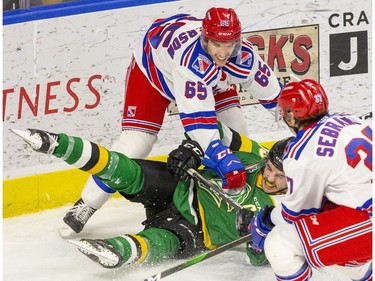 London Knight Liam Foudy is dumped by Kitchener Rangers defenceman Justin MacPherson at the Kitchener Memorial Auditorium in Kitchener, Ont. on Fridday Nov. 23, 2019. Derek Ruttan/The London Free Press