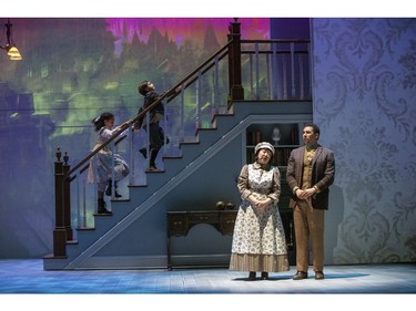 Abi Verhaeghe plays young Jane Banks, Hayden Baertsoen is her brother Michael, while Phoebe Hu is Mrs. Brill and Giovanni Spina is Robertson Ay in the Grand Theatre's production of Mary Poppins, on until Dec. 29.  (Derek Ruttan/The London Free Press)