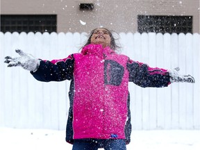 Syrian refugee Rahaf Ibrahim, 7, plays with snow for the first time in London, Ont. on Thursday March 8, 2018. Derek Ruttan/The London Free Press