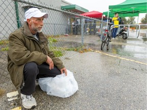 Don Bell of London waits outside the Silverwood Arena in London as the City of London tries a weeklong blitz to get homeless people off the street in London, Ont.  Photograph taken on Wednesday October 30, 2019.  (Mike Hensen/The London Free Press)