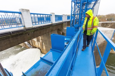 Maintenance mechanic Ian Rowbotham of the Upper Thames River Conservation Authority checks on the flow of water Thursday through a bypass valve at the Fanshawe Dam in London, which holds back Thames River water. With heavy rainfall this week entering the reservoir behind the dam, one gate was opened to allow more water out as the level rises. Photograph taken on Thursday October 31, 2019.  Mike Hensen/The London Free Press