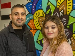 Omar Khoudeida, a Yazidi man working as a settlement counsellor at the London Cross-Cultural Learner Centre and Ramzya Issa, a Yazidi woman. (Mike Hensen/The London Free Press)