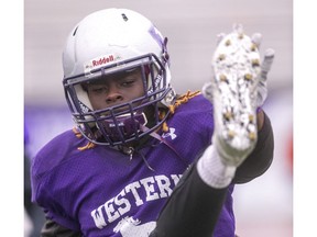 Western Mustangs defensive back Kojo Odoom stretches during practice Wednesday night. Odoom had an interception for a touchdown last week against Waterloo in the Yates Cup semi-final and said it was "the best feeling ever."  (Mike Hensen/The London Free Press)