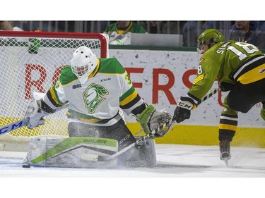 Dylan Myskiw of the Knights stops Matthew Struthers, of the North Bay Battalion, in close, near the end of the first period of their game Friday, Nov. 8, 2019 at Budweiser Gardens. Seconds later Struthers was in again and got the puck across to teammate Mitchell Russell who put the Battalion up 1-0. Mike Hensen/The London Free Press