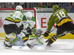 Liam Foudy of the Knights back checks Matthew Struthers of the North Bay Battalion, in close, near the end of the first period of their game Friday , Nov. 8, 2019. at Budweiser Gardens. The rebound off of the pad of Knights goaltender Dylan Myskiw went  across the crease to Mitchell Russell, who banged it in to put the Battalion up 1-0. Mike Hensen/The London Free Press