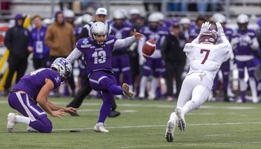 Western's Marc Legghio makes the score 22-13 in the Yates Cup with a field goal past the attempted block of McMaster's Mitch Garland in London, Ont.  McMaster won 29-15.
Photograph taken on Saturday November 9, 2019. 
Mike Hensen/The London Free Press/Postmedia Network