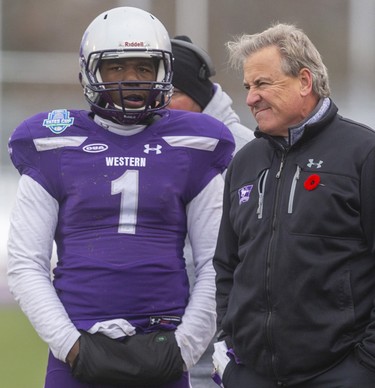 Western quarterback Kevin John talks to head coach Greg Marshall as he was forced to play most of the game after starter Chris Merchant was injured and taken out in the first half in the Yates Cup against McMaster on Saturday November 9, 2019. 
The Marauders came into town and defeated the Mustangs 29-15 for the Yates Cup championship.
Mike Hensen/The London Free Press/Postmedia Network