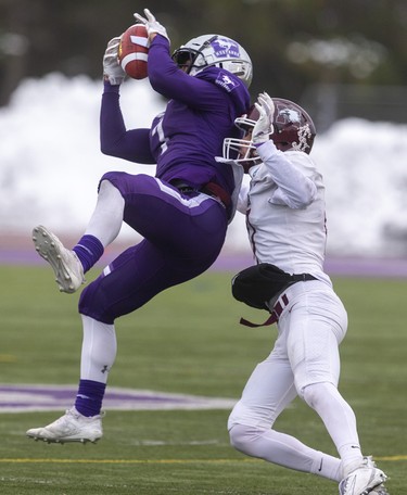 Cole Majoros pulls in a Kevin John pass for a gain in front of McMaster cornerback Nolan Putt during the Yates Cup championship game Saturday November 9, 2019 at Western. It was too little too late as the Marauders took control and won 29-15. 
Mike Hensen/The London Free Press/Postmedia Network