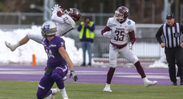 Western's Brett Ellerman looks back as Josh Cumber of the McMaster Marauders intercepts a Kevin John pass during the Yates Cup championship game Saturday ,November 9, 2019 at Western. After a sloppy start the Marauders took control and won 29-15. 
Mike Hensen/The London Free Press/Postmedia Network