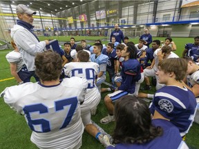 Lucas offensive co-ordinator Steve Samways has a quick wrap up with the team after practice at the BMO Centre on Friday. The Vikings will have their hands full with the CCH Crusaders when they meet next week for the city bragging rights and the WOSSAA championship. (Mike Hensen)