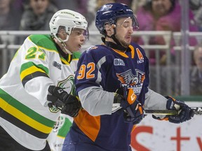 Kirill Steklov of the Knights shoves Ethan Keppen of the Flint Firebirds from in front of the Knights net in the first period of their game at Budweiser Gardens on Friday November 15, 2019.  Mike Hensen/The London Free Press/Postmedia Network