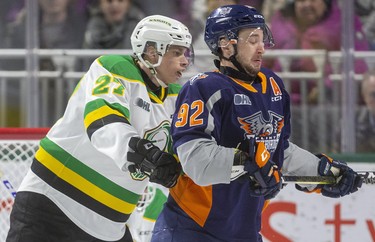 Kirill Steklov of the Knights shoves Ethan Keppen of the Flint Firebirds from in front of the Knights net in the first period of their game at Budweiser Gardens on Friday November 15, 2019.  Mike Hensen/The London Free Press/Postmedia Network