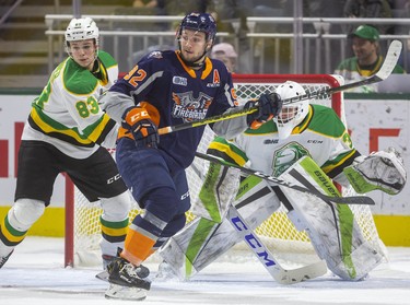 Ethan Keppen of the Flint Firebirds camps in front of Knights goalie Dylan Myskiw and gets the attention of Knight's defenceman Hunter Skinner in the first period of their game at Budweiser Gardens on Friday November 15, 2019.  Mike Hensen/The London Free Press/Postmedia Network