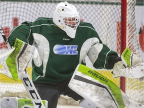 Knights goalie Dylan Myskiw has a puck go off his glove and behind the net during practice at Budweiser Gardens in London Wednesday Nov. 20, 2019.  (Mike Hensen/The London Free Press)