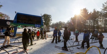 Skiers enjoy the sunshine on the first weekend of operation at Boler Mountain in London. The non-profit opened their 73rd year, their earliest opening in 30 years. Marty Thody, a member of the management team, said they took advantage of an earlier cold snap to make snow, and with all their advances in snowmaking, they were able to get five runs open early. 
Mike Hensen/The London Free Press/Postmedia Network