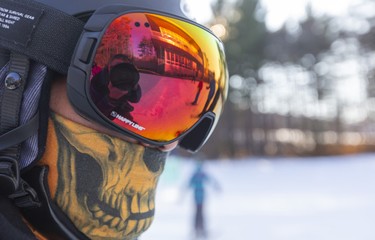 Mateo Mejia of Komoka cuts an ominous figure with his facemask as he enjoys the first weekend of skiing at Boler Mountain in London. The non-profit opened their 73rd year Saturday, their earliest opening in 30 years. Mike Hensen/The London Free Press/Postmedia Network