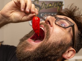 Mike Jack of London is in the Guinness book of world records for his ability to eat ghost peppers.  Mike Hensen/The London Free Press/Postmedia Network