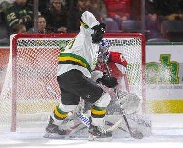 London Knights Nathan Dunkley gets in too tight on Windsor's Kari Piiroinen and can't dig the puck out of Piiroinen's pads during the first period of their OHL game Friday night at Budweiser Gardens in London. Photograph taken on Friday November 29, 2019. 
Mike Hensen/The London Free Press/Postmedia Network