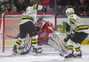 London Knights forward Nathan Dunkley gets in too tight on Windsor's Kari Piiroinen as Luke Evangelista comes in to help, but they can't dig the puck out during the first period of their OHL game Friday night at Budweiser Gardens in London. Photograph taken on Friday November 29, 2019. 
Mike Hensen/The London Free Press/Postmedia Network
